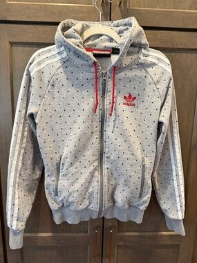 adidas x Pharrell Gray Zip Hoodie with White Stripes and Red Accents